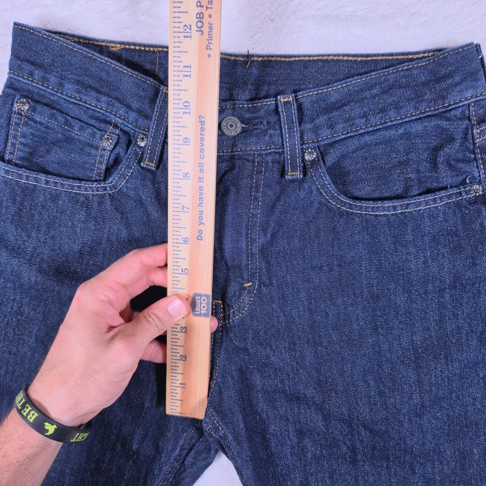Levi's 527 Slim Bootcut Mens 31/32 Dark Blue Denim Raw Hem Jeans S110760